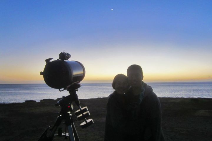 a person standing next to a body of water